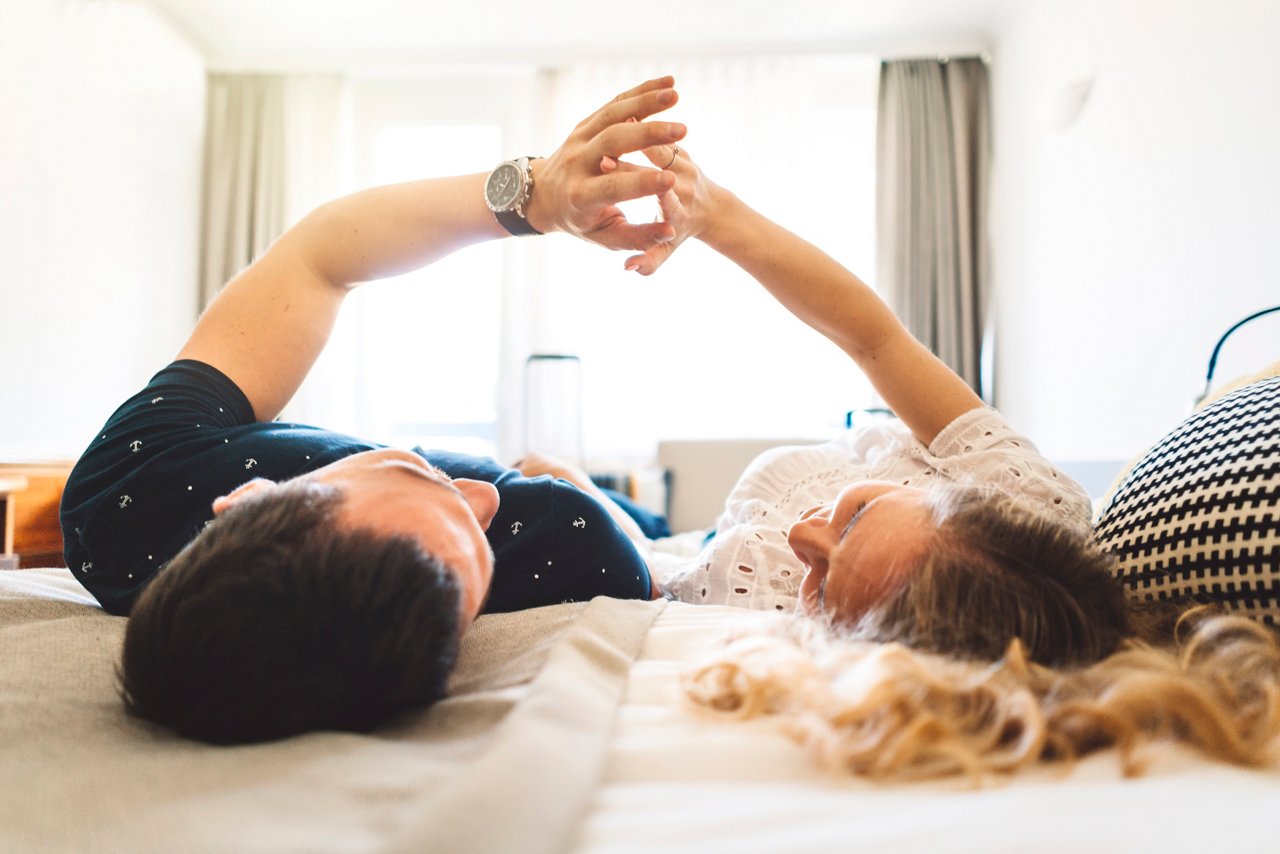 Couple enjoying their morning in hotel room